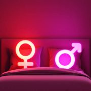 Gender symbol with bed double motel love female male valentine hotel room dim light neon bright romantic night sleep couple sexual intercourse sensual erotic dreamy symbol theme room.